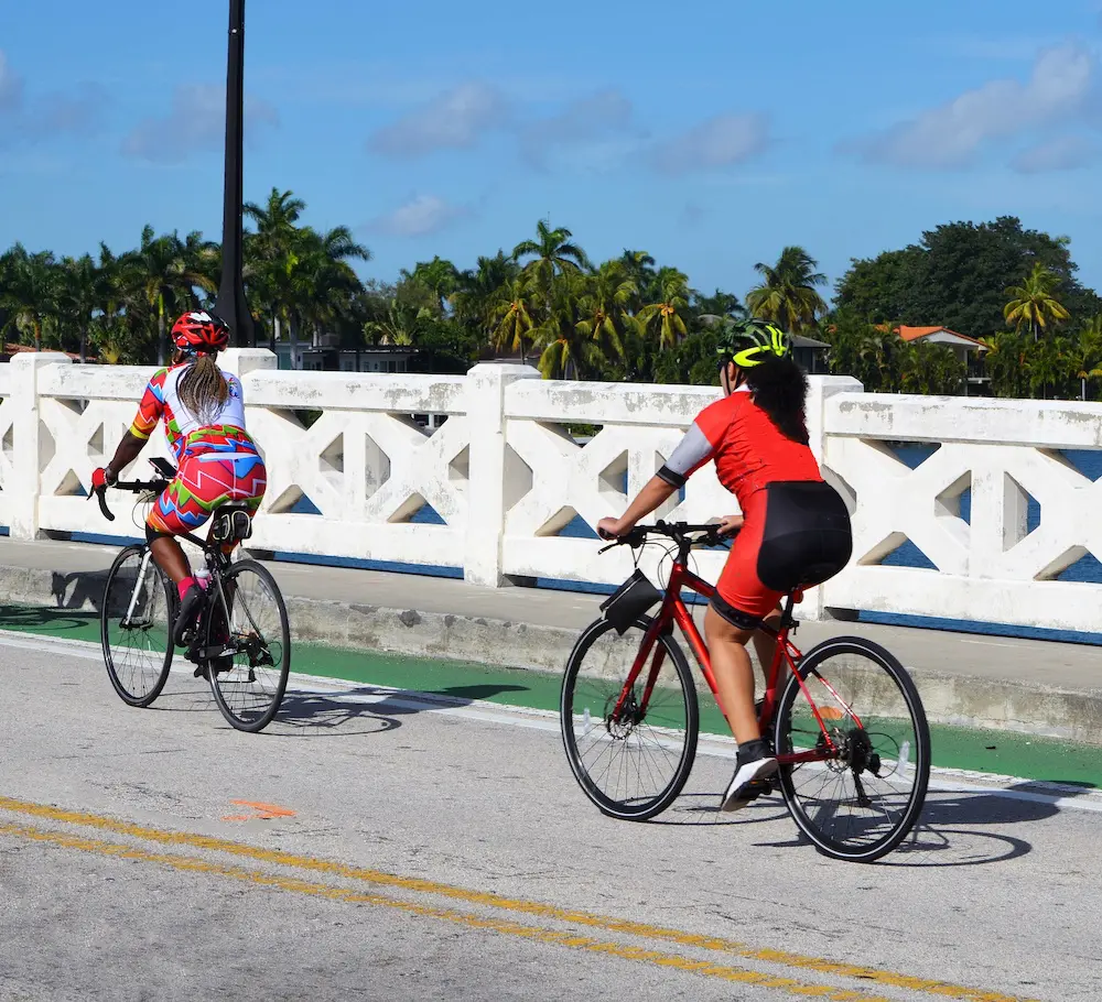 Women cyclist on the Venetian Causeway in Miami Beach,Florida