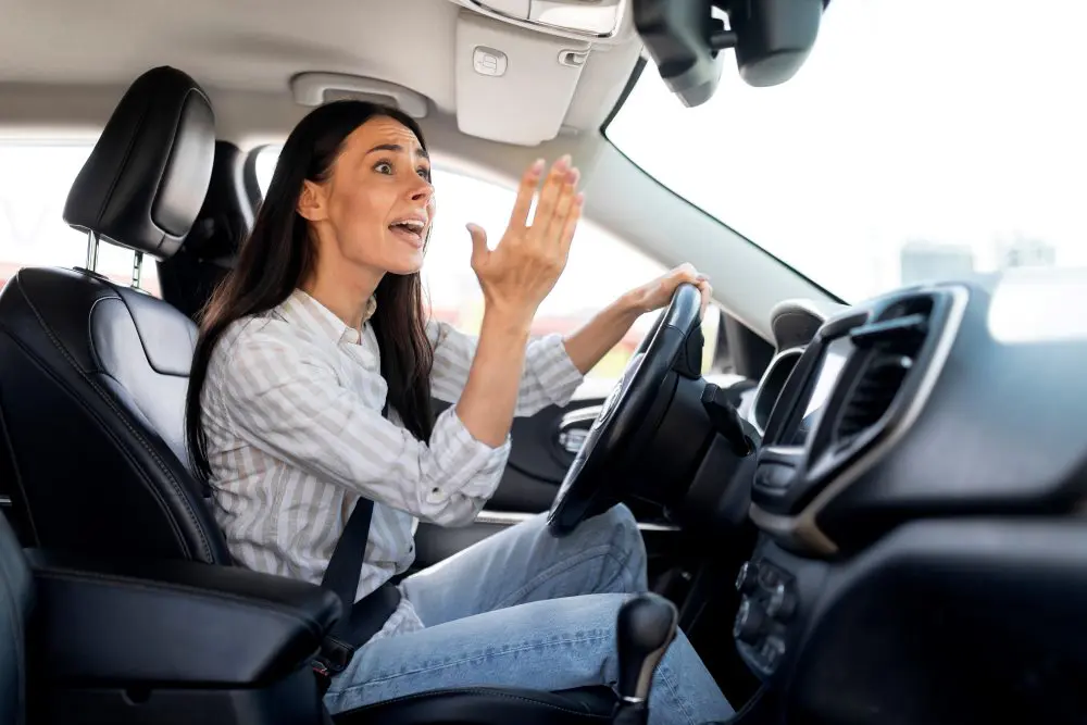 A woman screaming at another driver on the road.