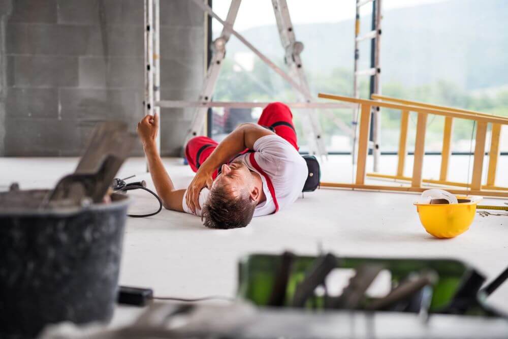 An employee falling off a ladder during a construction job.